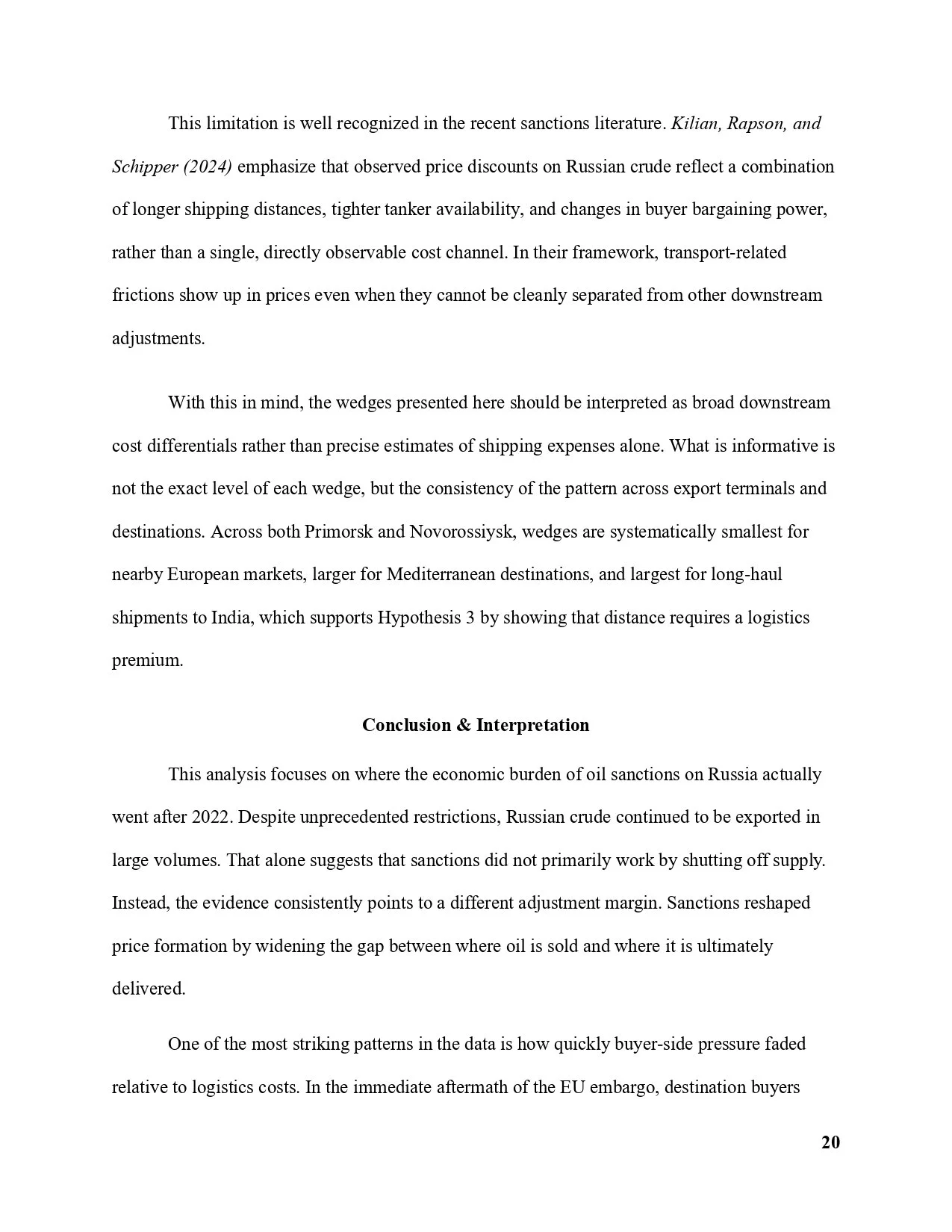 Close-up of a printed page from a report or academic paper showing text about oil sanctions and trade logistics.